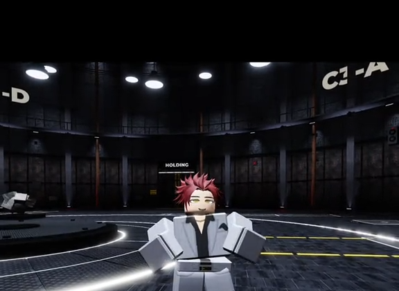 A red-haired character in a white outfit standing in a circular cell block marked HOLDING, subtitled The chosen ones can control the power. The rest die.
